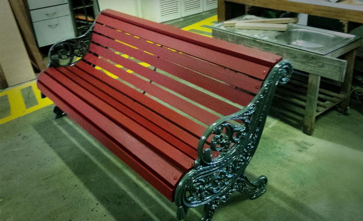 Outdoor bench restored with new wood and paint