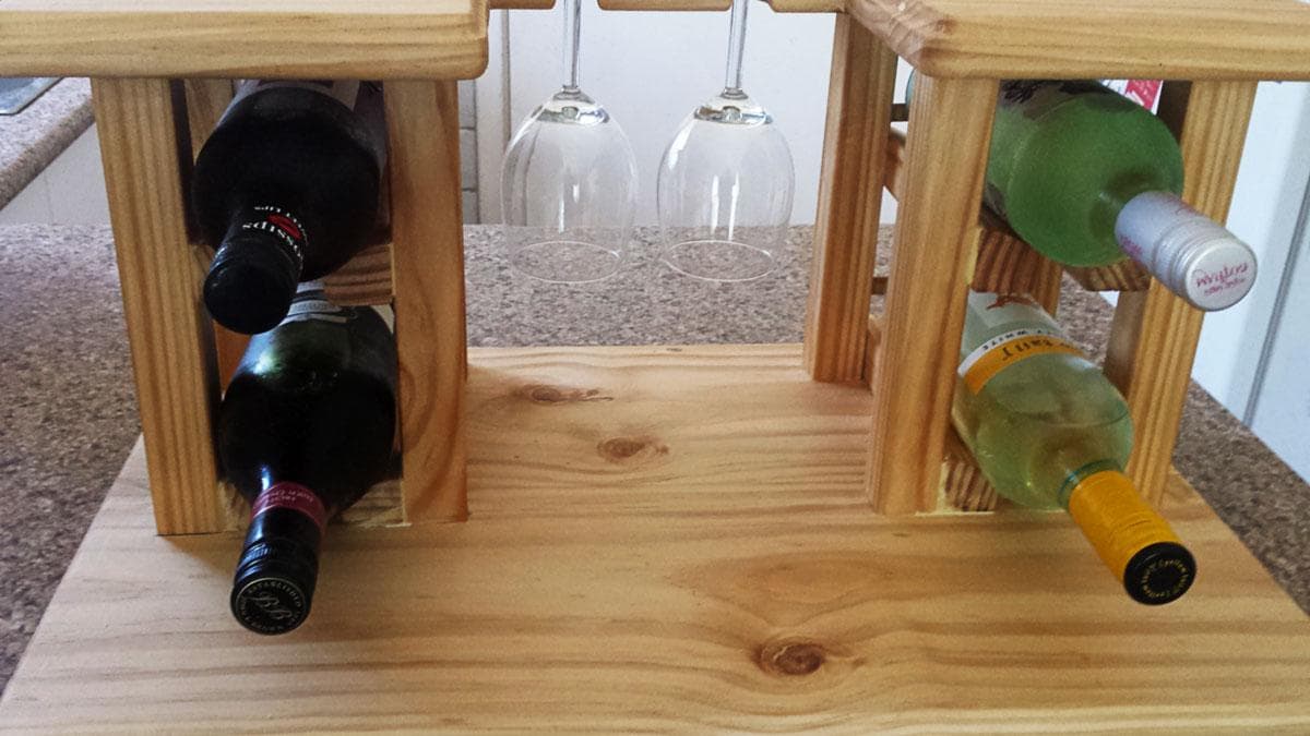 Wooden rack from holding up to four wine bottles and two wine glasses